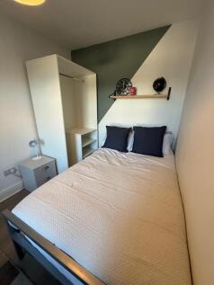Bright, neatly presented bedroom with a double ...