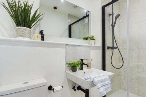 A modern and well-maintained bathroom featuring...
