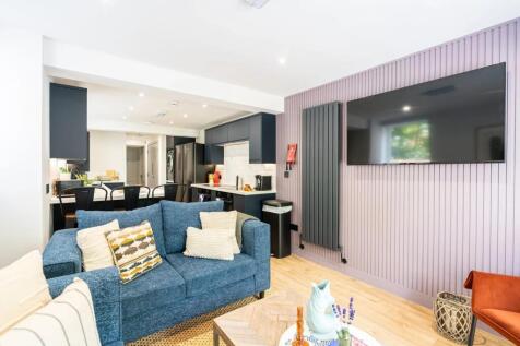 Bright, modern open-plan living area with a com...