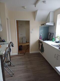 Bright fitted kitchen with a worktop, integrate...
