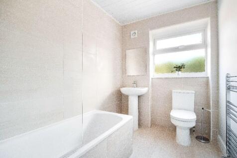 Bright, modern bathroom with a full bath and cr...