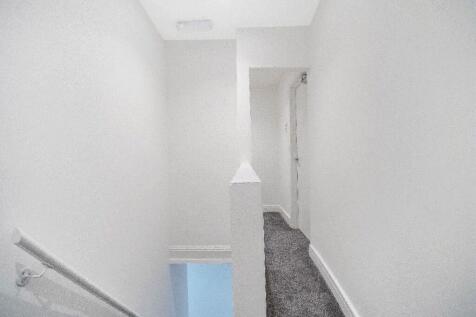 Bright, freshly painted upstairs landing with c...