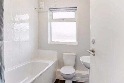 Bright, modern bathroom with a full bath and sh...