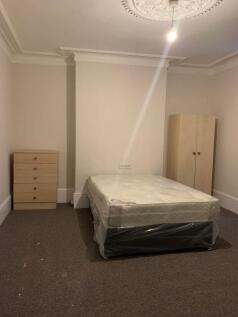 Bright double bedroom with high decorative ceil...