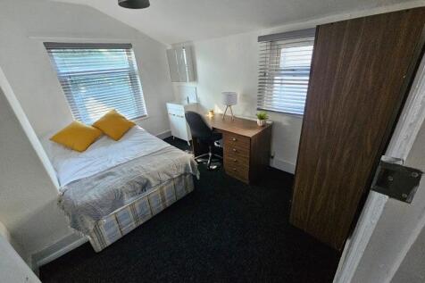 Bright and cozy double bedroom featuring a comf...