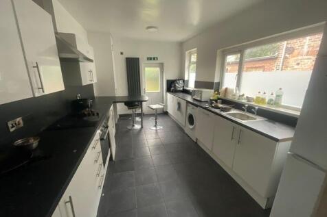 Bright and practical kitchen featuring modern w...