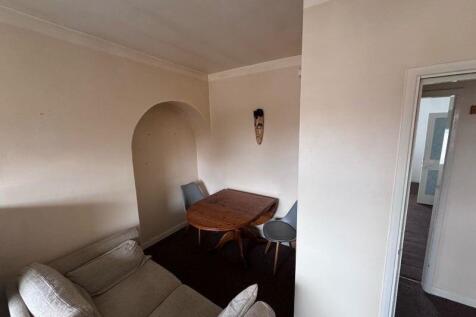 Cozy living room featuring a comfortable sofa a...