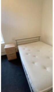 Cozy double bedroom featuring a comfortable dou...