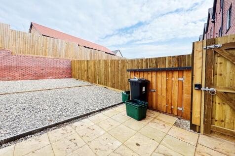 Private low-maintenance rear garden with paved ...