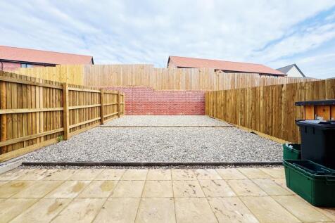 Private low-maintenance rear garden with paved ...