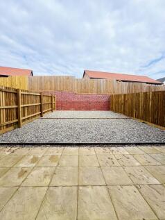 Private low-maintenance rear garden with paved ...