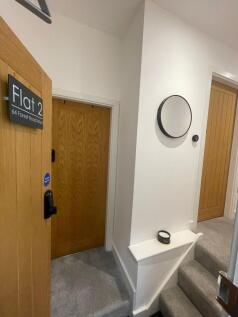 Bright, freshly decorated hallway with neutral ...