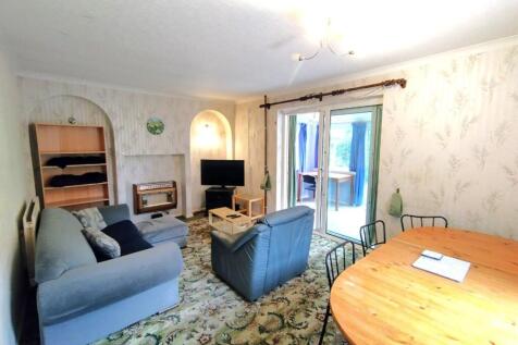 Bright, comfortable living room with seating ar...