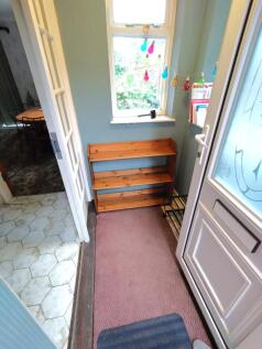 Welcoming front entrance with a window letting ...