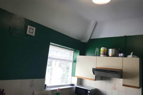 A functional kitchen with a window providing na...