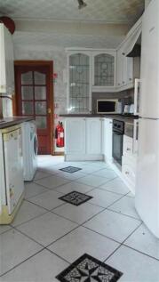 This charming kitchen features a blend of moder...
