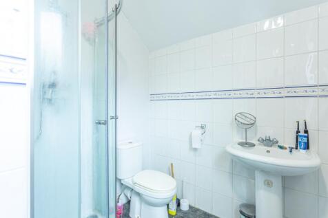 A well-maintained bathroom featuring a modern s...