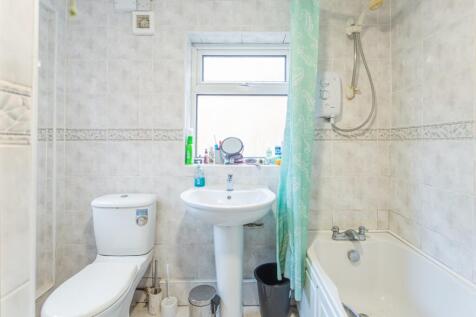 Bright and functional bathroom featuring a clea...