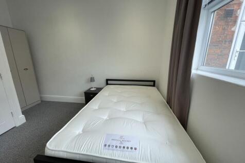A bright and clean double bedroom with ample na...