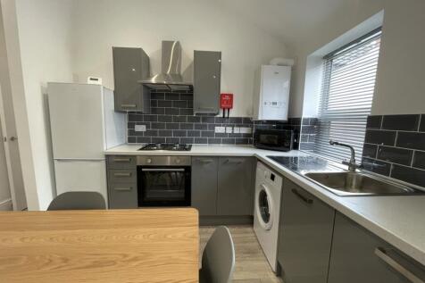 A modern and well-equipped kitchenette with amp...