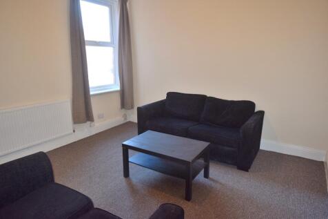Spacious and inviting living room with natural ...