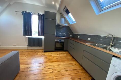 A bright and modern kitchenette featuring styli...