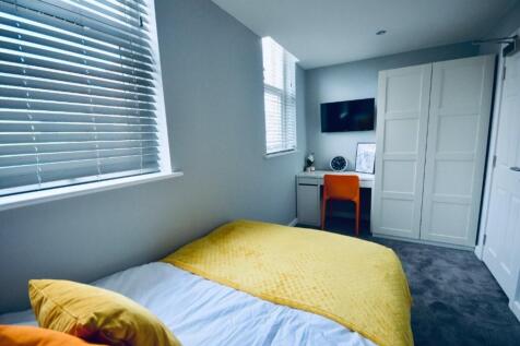 A bright and inviting double bedroom featuring ...