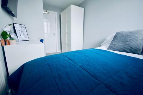 A bright and inviting double bedroom featuring ...