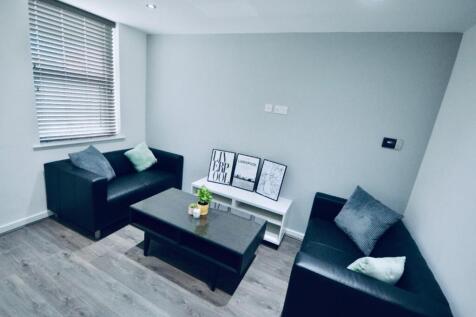 A bright and inviting living room with modern d...