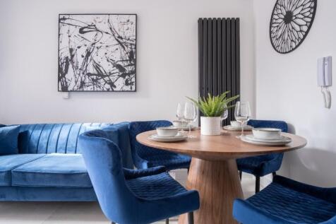 This contemporary living room features stylish ...