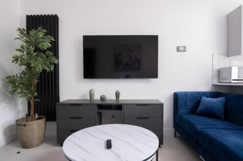 Stylish and contemporary living room featuring ...