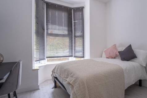 Bright and inviting double bedroom featuring a ...