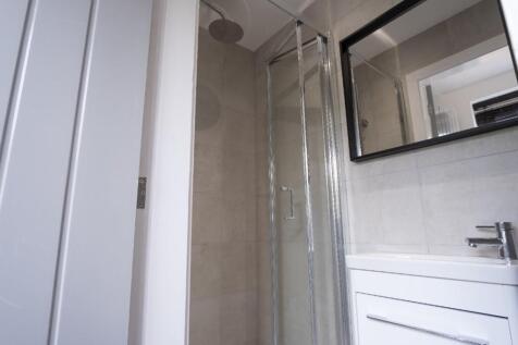 Modern bathroom featuring a sleek shower, styli...