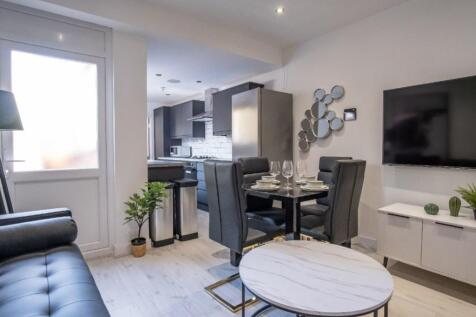 Stylish and modern living room featuring sleek ...