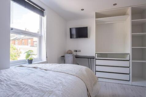 A beautifully designed double bedroom featuring...