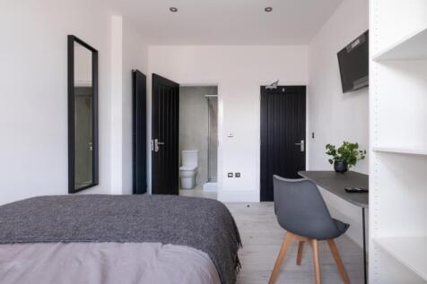 A modern double bedroom featuring a comfortable...