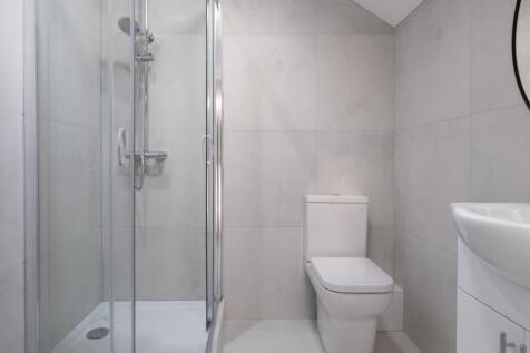 Stylish and modern bathroom featuring a sleek s...