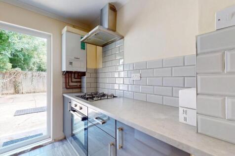Bright and modern kitchen featuring sleek count...