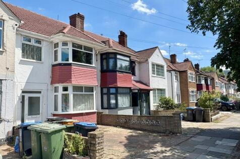 A charming row of terraced houses with well-mai...