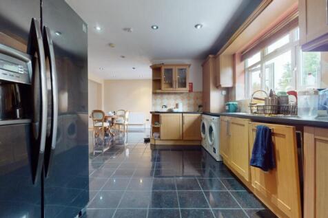 A bright and spacious kitchen featuring modern ...