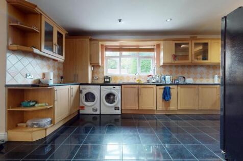 Bright and spacious kitchen featuring ample woo...