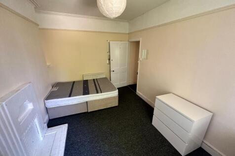 A spacious and inviting double bedroom, perfect...