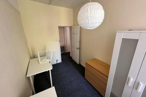 A tidy hallway with ample storage space, perfec...