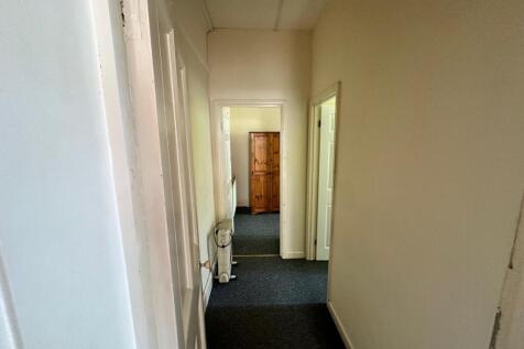 A tidy hallway leading to well-maintained rooms...