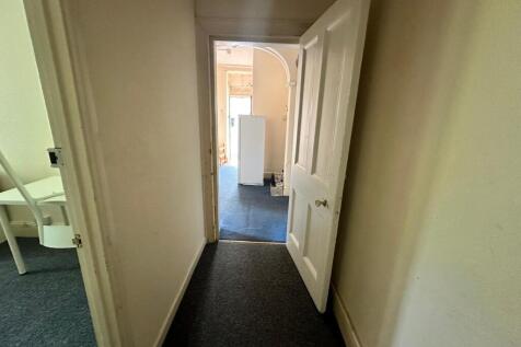 A well-maintained hallway leading to other room...