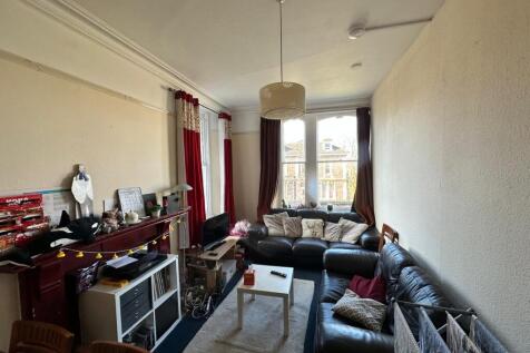 Bright and inviting living room featuring a spa...