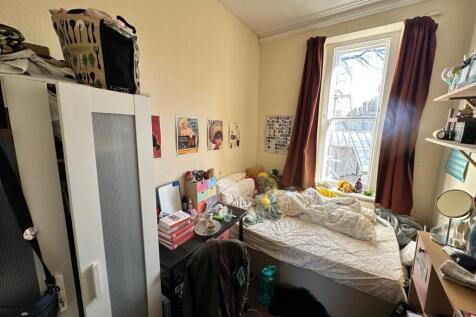 A cozy double bedroom filled with natural light...