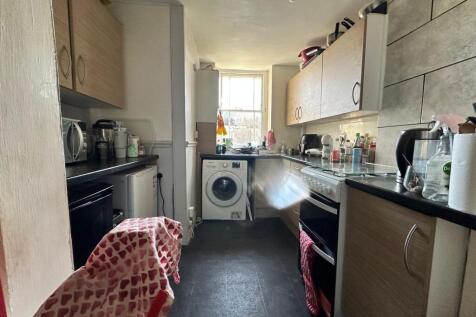 A bright and functional kitchen featuring a ran...