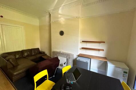 A bright and inviting living room with comforta...