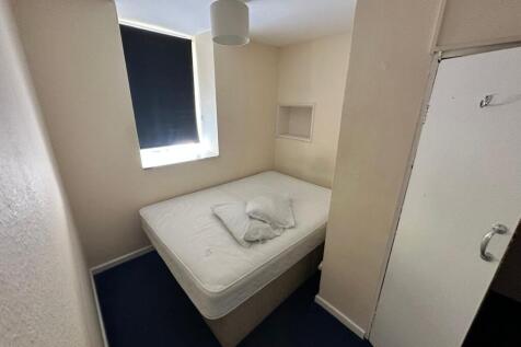 A cozy double bedroom with a comfortable mattre...
